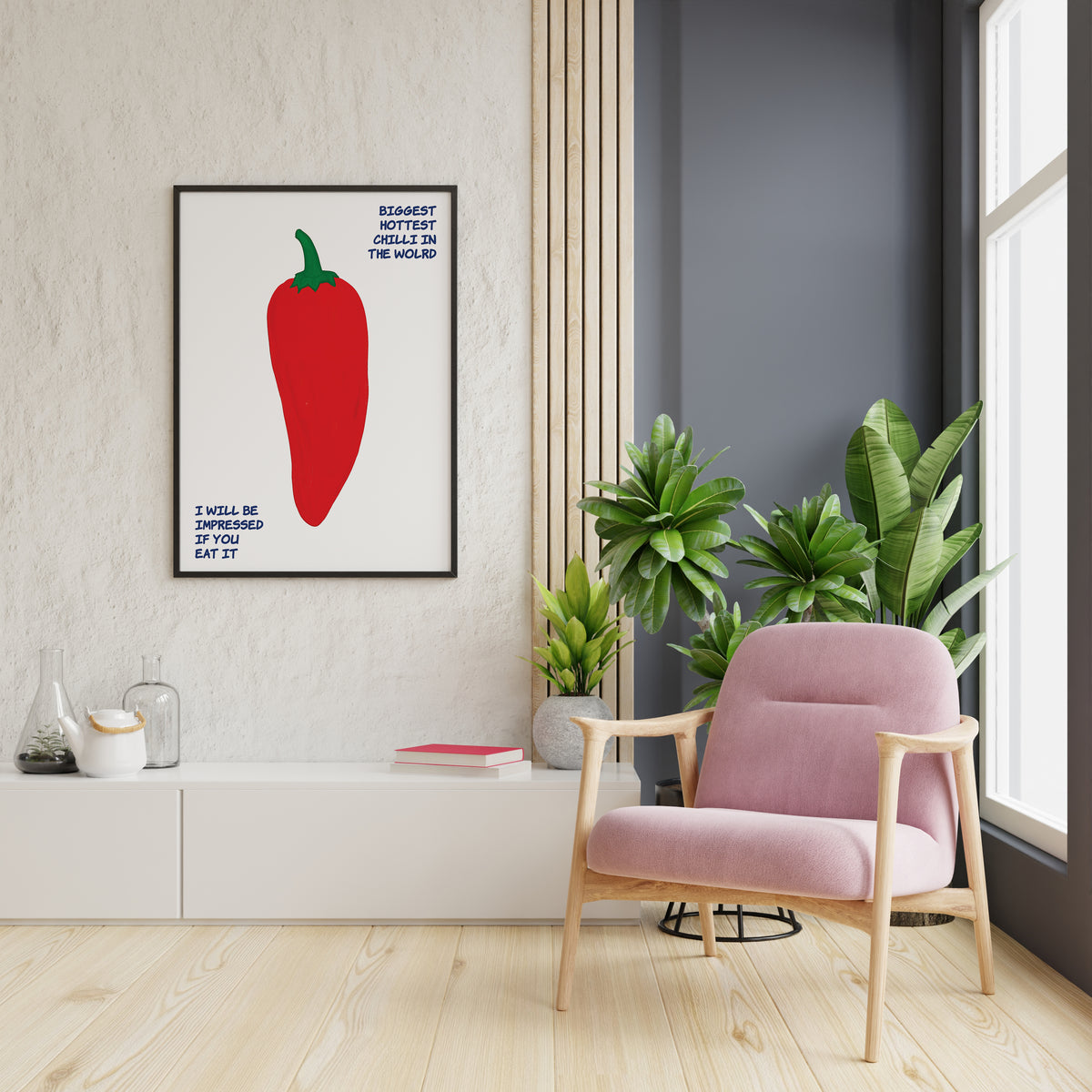 Playful red pepper poster with green stem and dark blue text displayed on an interior wall