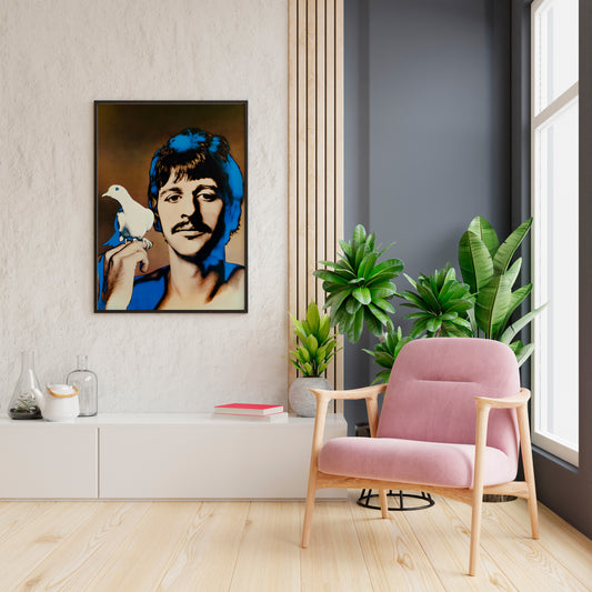 Ringo Starr Beatles poster displayed beside a pink chair and indoor plants in a bright living room