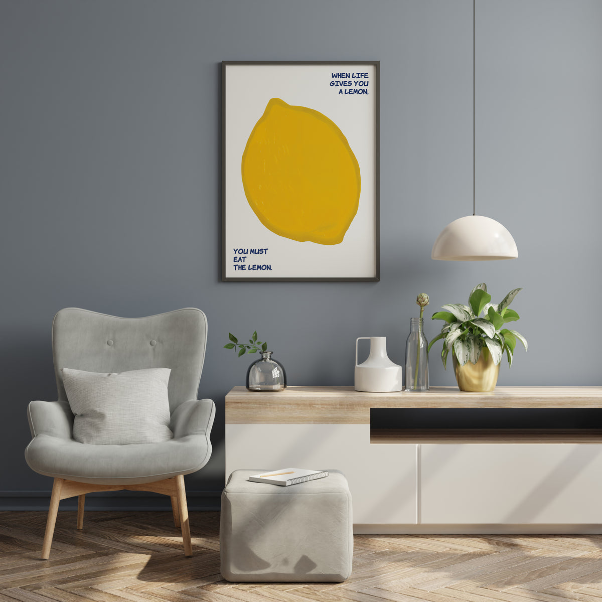 Yellow lemon print with playful blue quote displayed in a modern interior