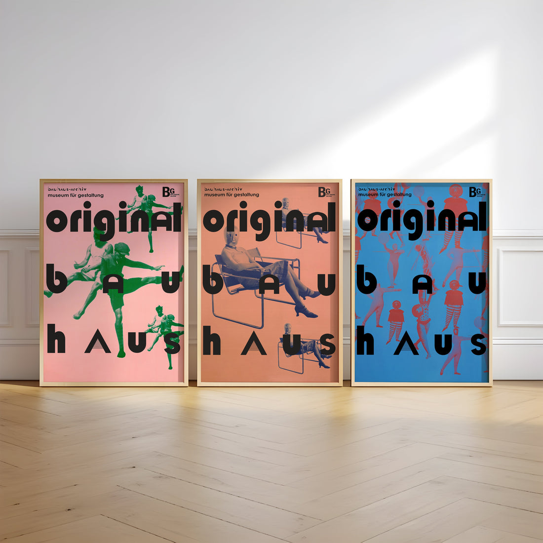 Bauhaus wall art set with three framed original posters in pink, orange and blue, styled as matching prints for modern home decor.