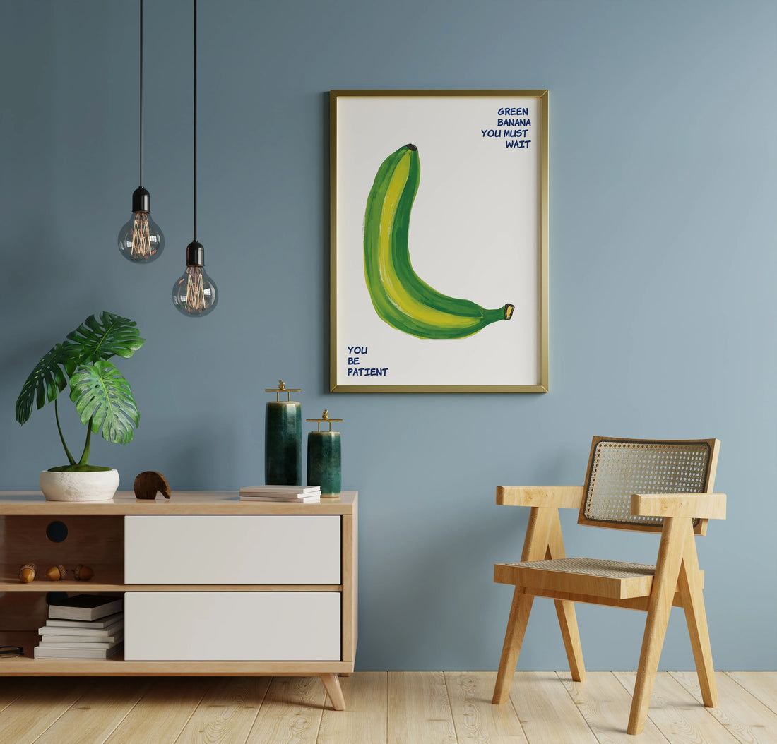 Kitchen and dining room interior with blue wall, framed banana wall art, wooden chair and modern sideboard