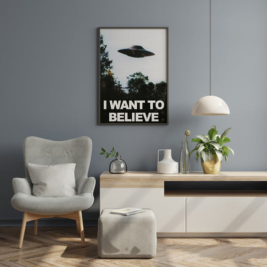 I Want to Believe alien poster displayed as a vertical focal point in a living room.