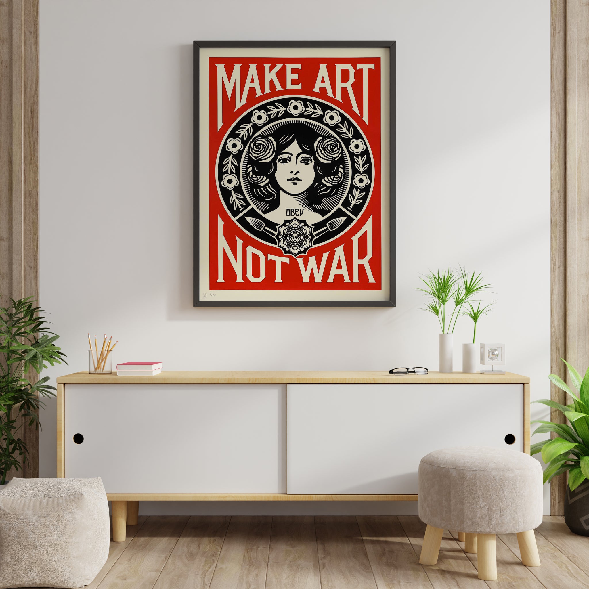 Anti-war art poster with a woman, roses and Make Art Not War lettering displayed in a modern interior.
