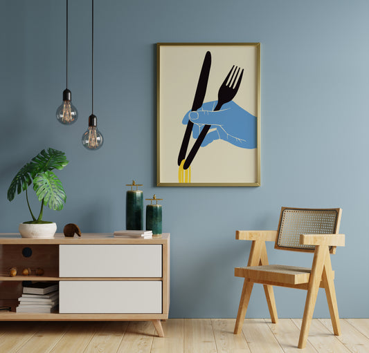 Asian noodles poster with black cutlery, blue hand and yellow strands displayed on a blue wall.