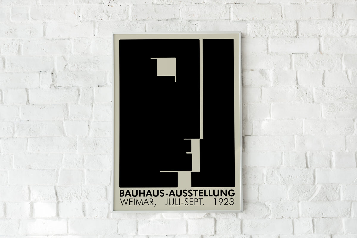 Bauhaus-Ausstellung Weimar poster on white brick wall