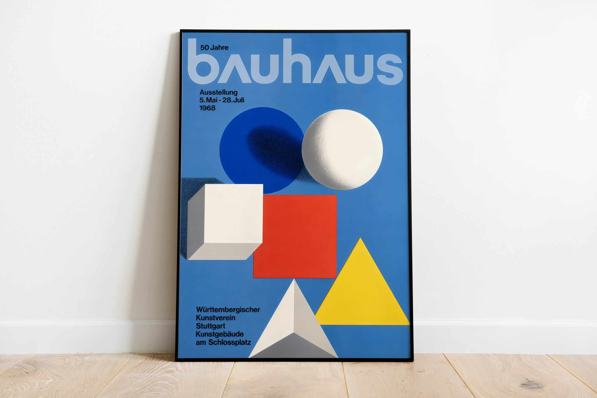 Bauhaus poster with geometric shapes in bold primary colors on blue background