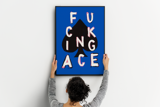 Bold ace poker print being placed on a clean wall