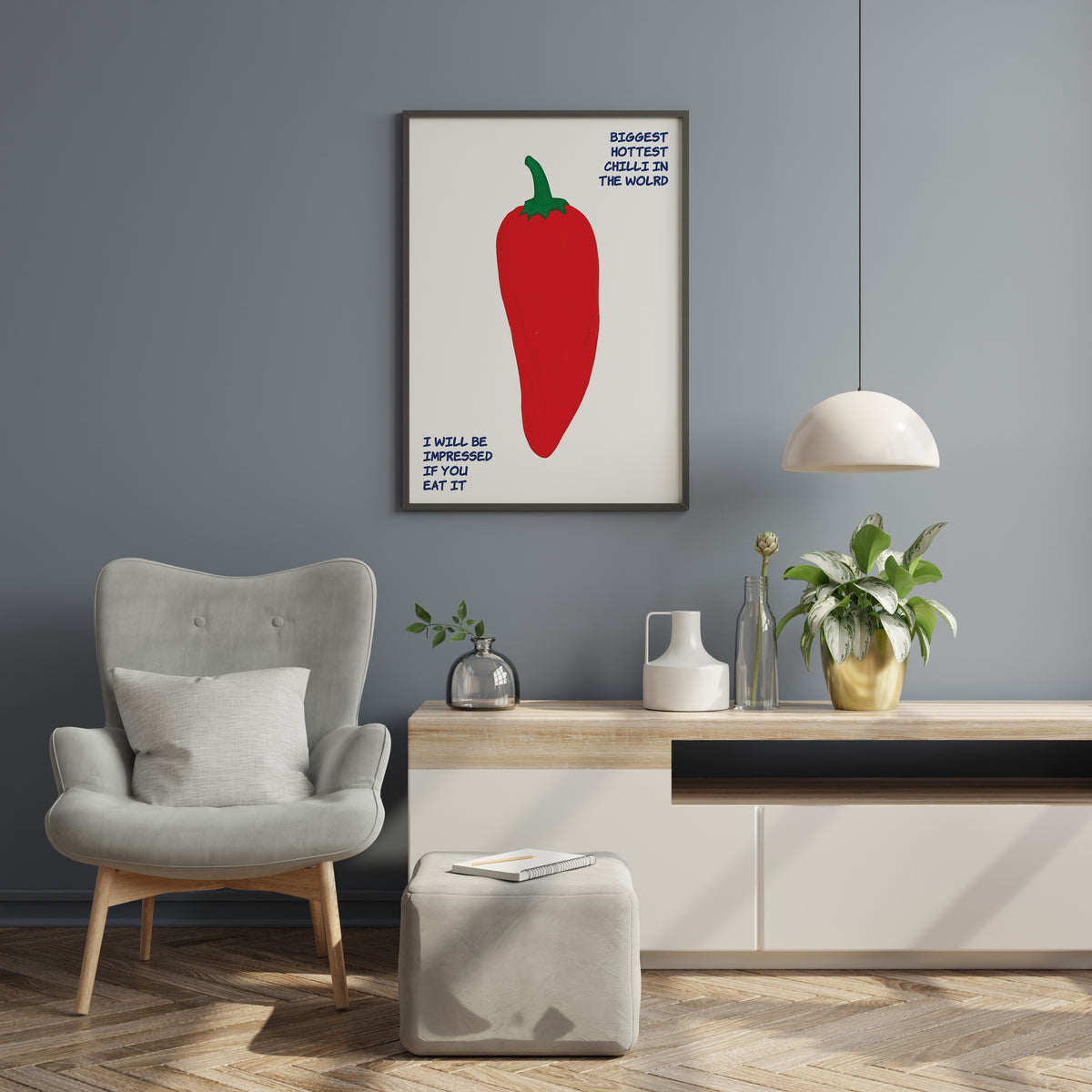 Red chilli pepper print with playful blue typography displayed in a contemporary interior