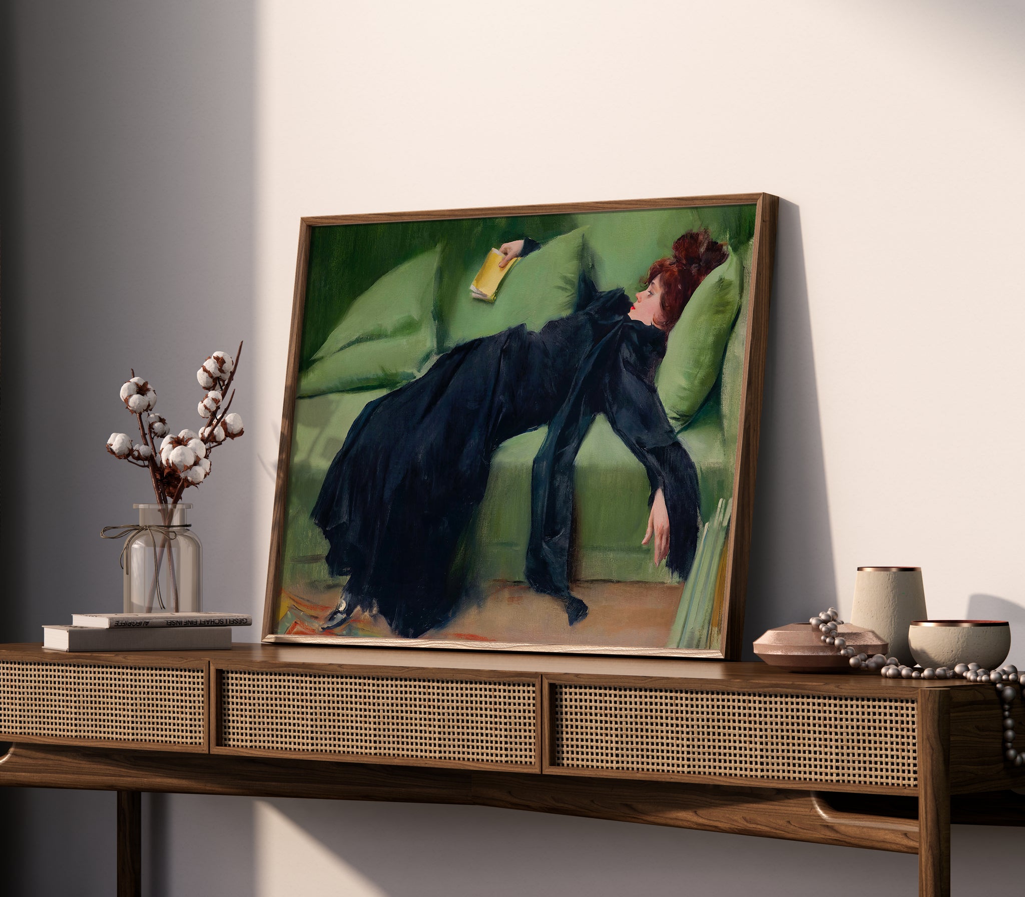 Decadent young woman painting poster showing woman holding book on sofa