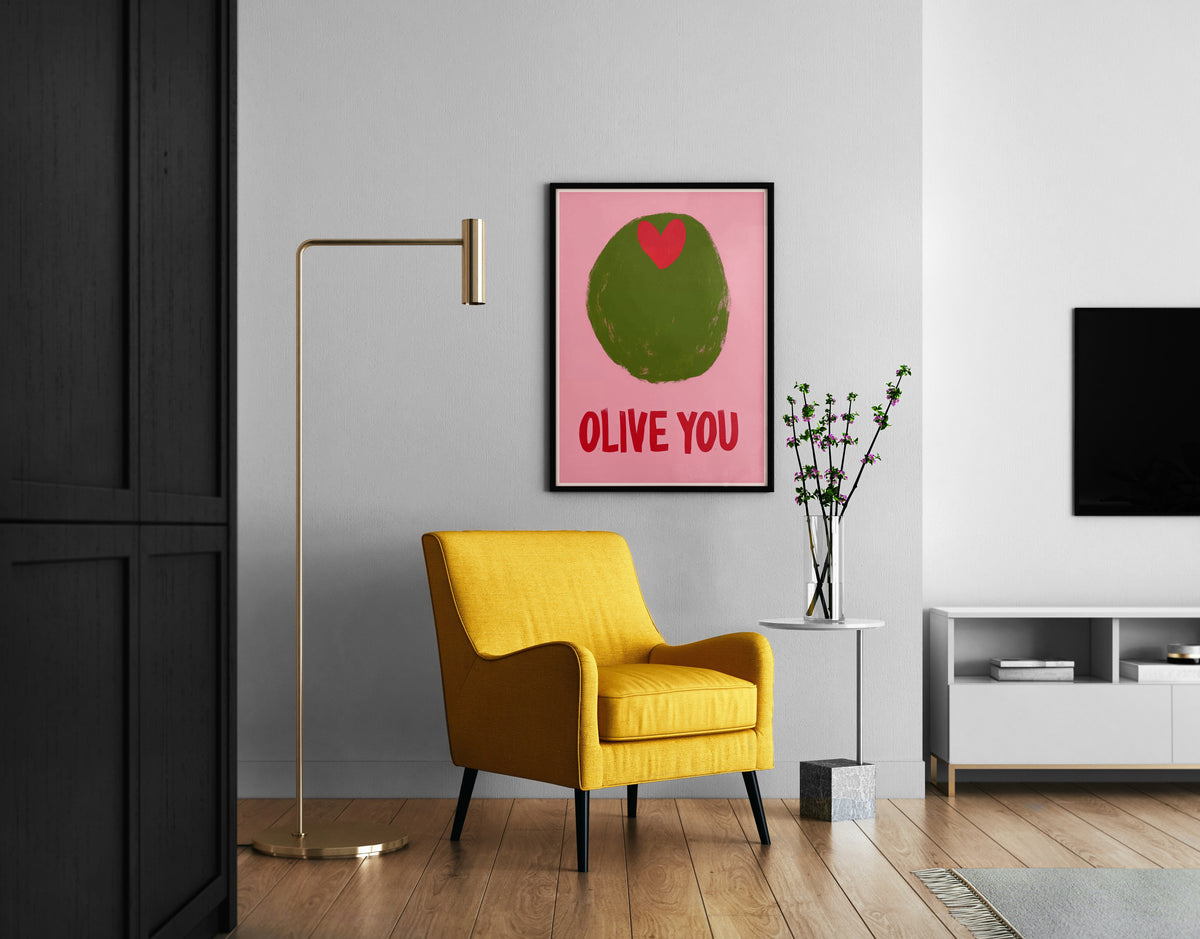 Green olive wall art with red heart and bold typography shown in a modern room