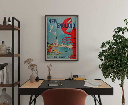 New England Greyhound poster with a red lobster and harbor illustration, displayed in a home office