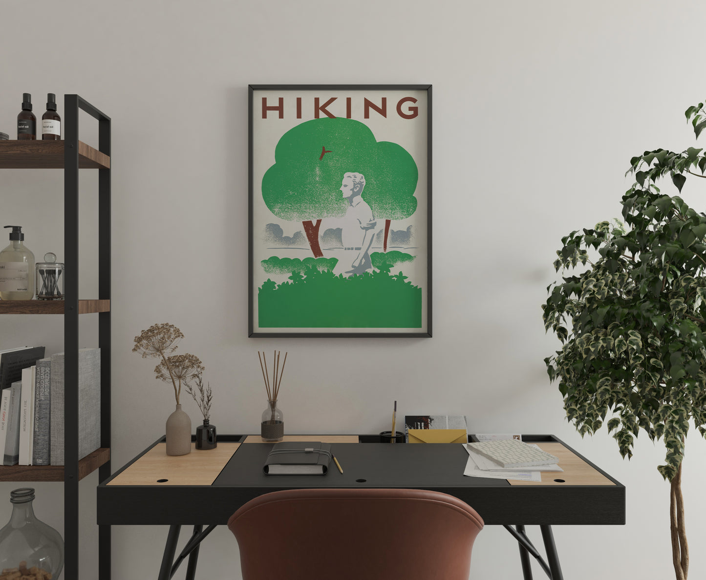 Hiking poster with vintage green landscape artwork displayed above a modern home office desk.
