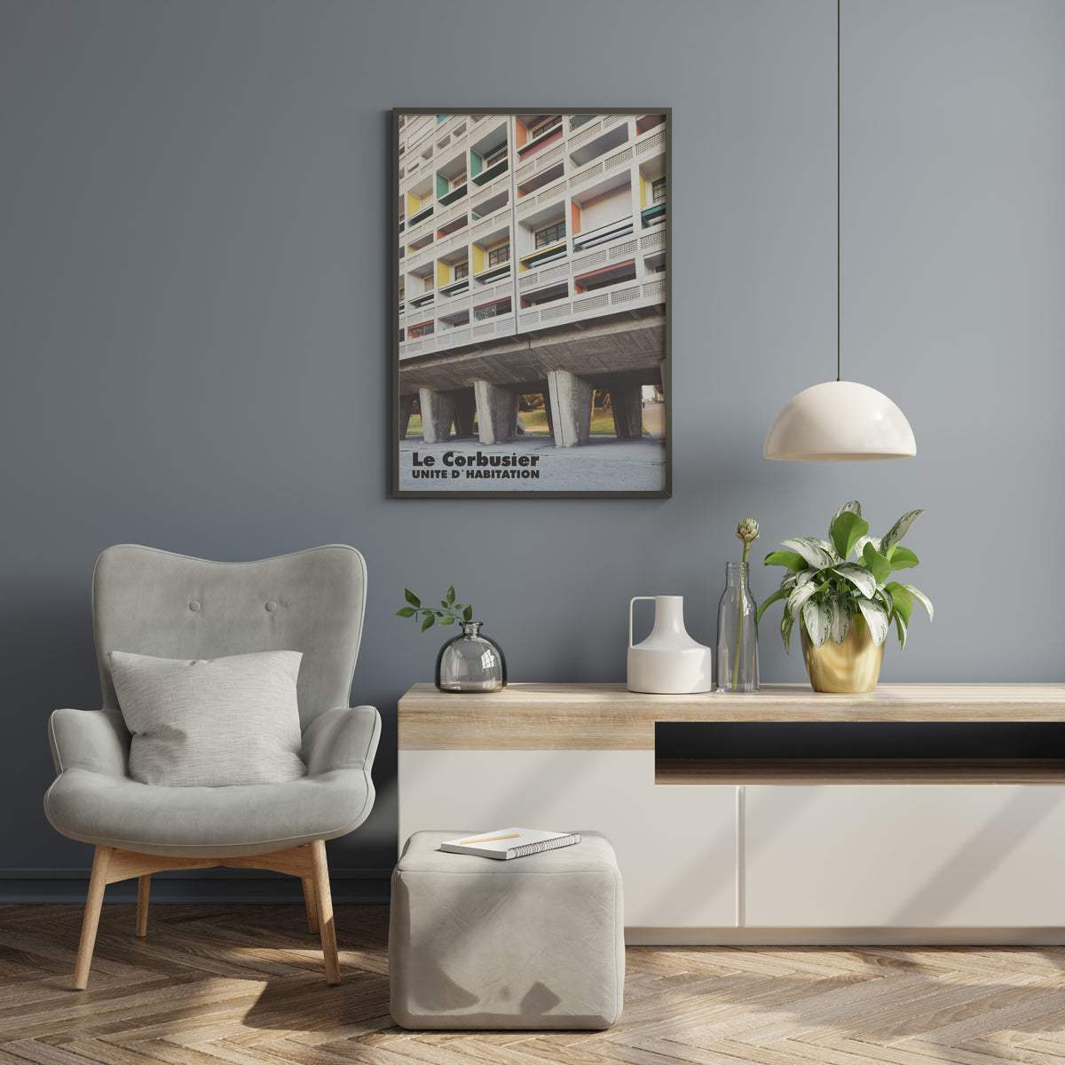 Le Corbusier UNITE D'HABITATION poster displayed on a grey wall in a modern living room
