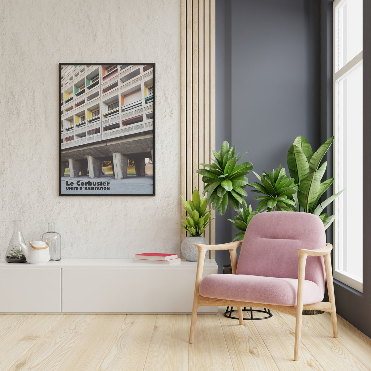 Le Corbusier UNITE D'HABITATION poster displayed in a modern living room with pink chair and plants