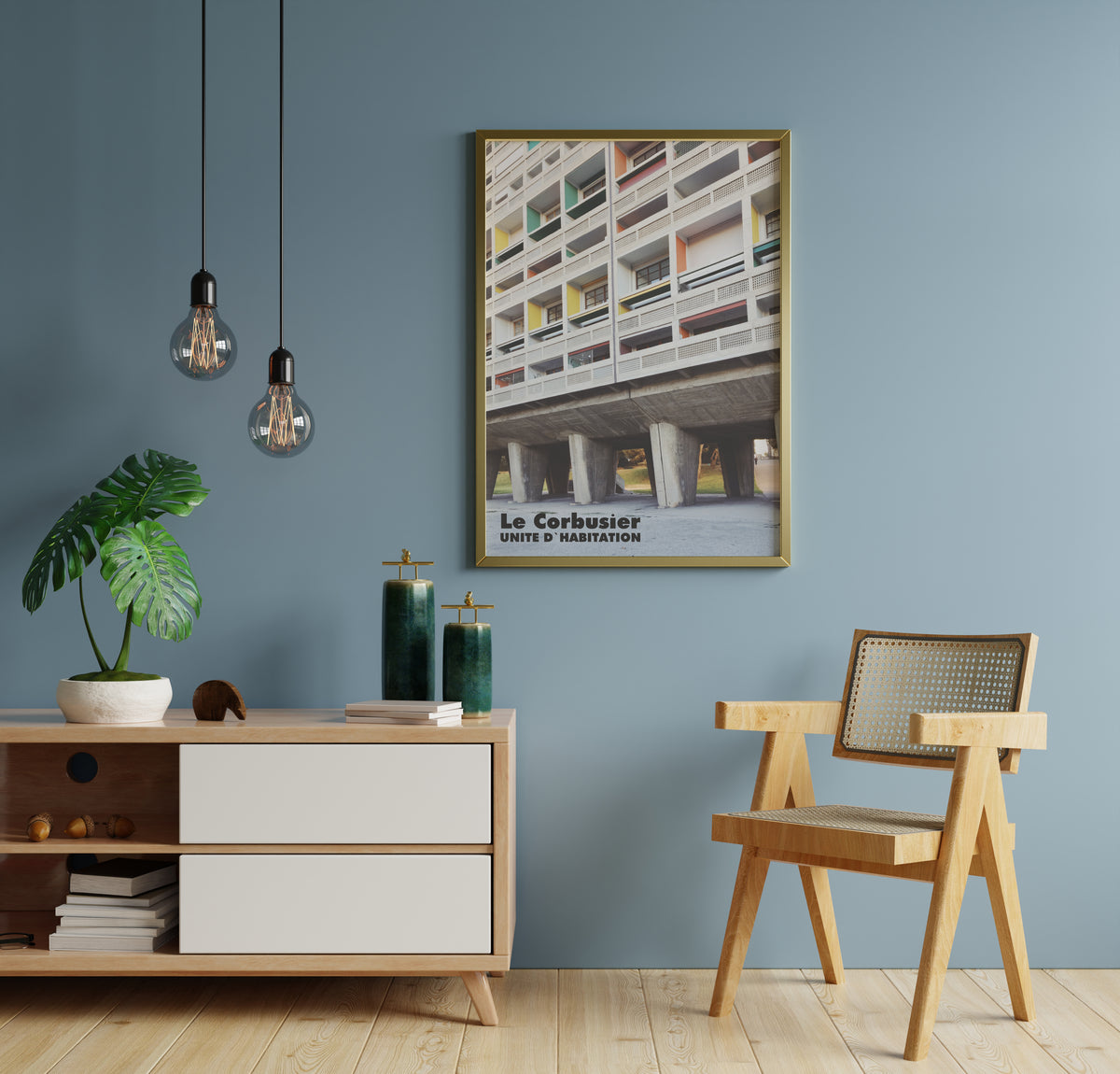 Le Corbusier Unité d'Habitation poster in a gold frame on a blue wall