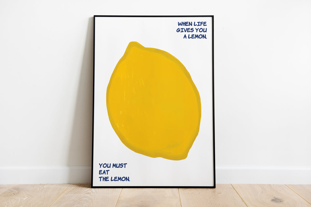 Lemon poster with oversized yellow fruit and blue handwritten quote on a white background