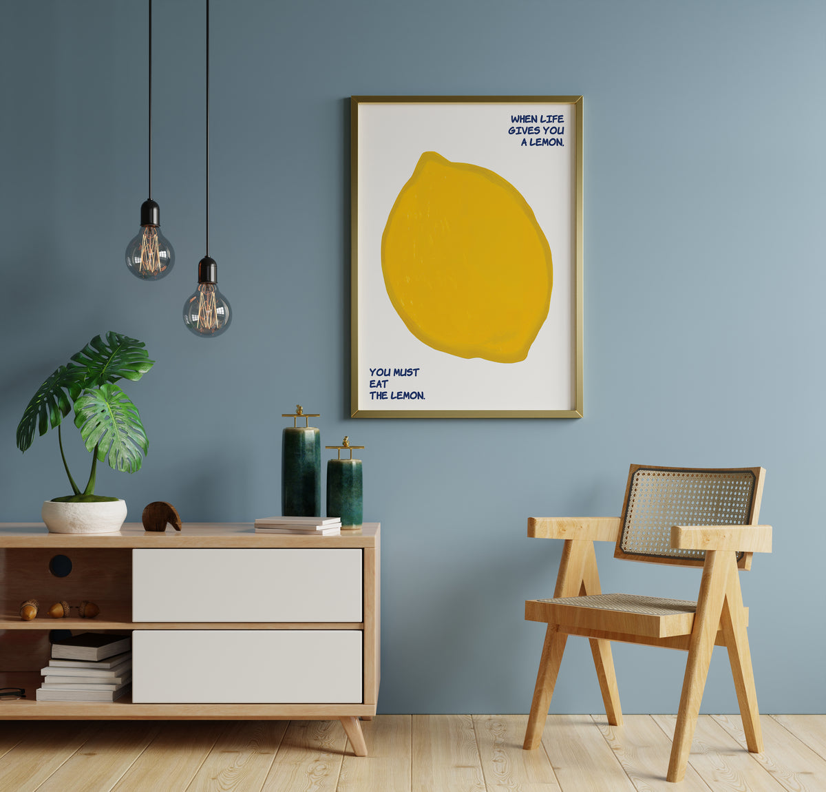 Lemon wall art with bold yellow fruit and handwritten quote in a styled room