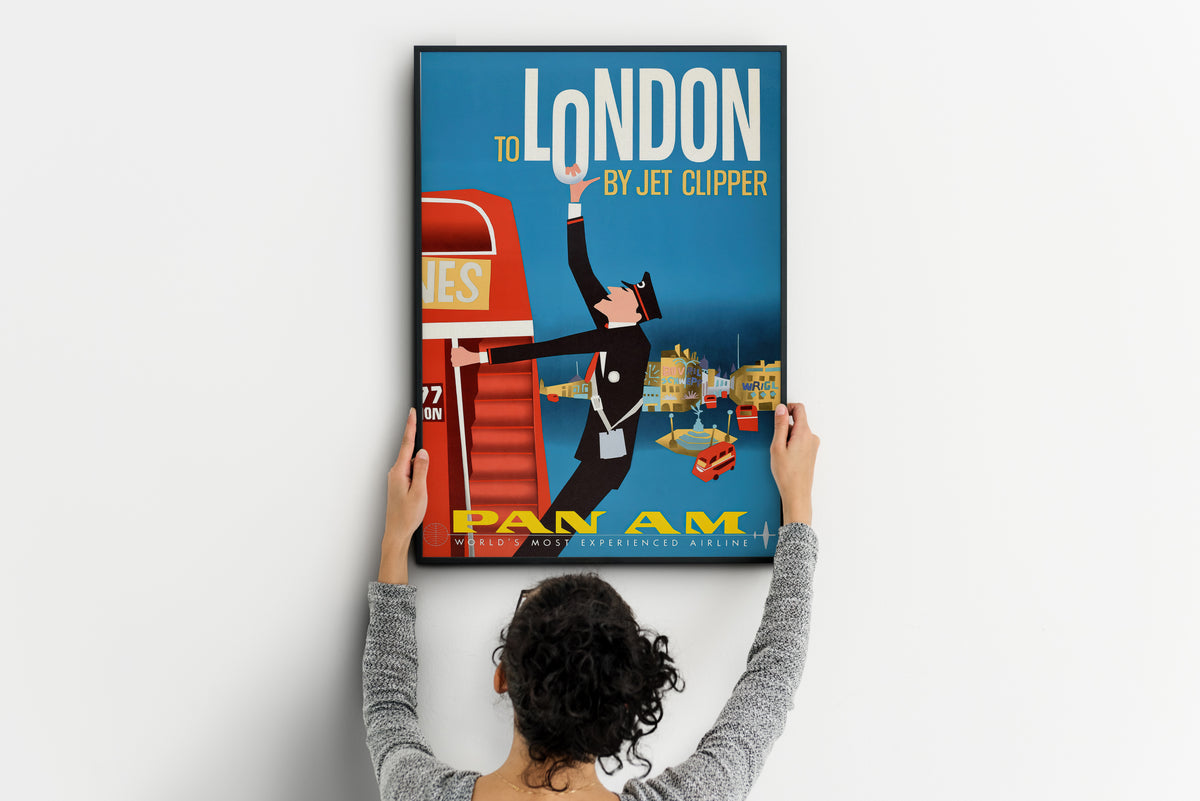 Pan Am London poster with red boarding stairs and uniformed figure displayed in a living room