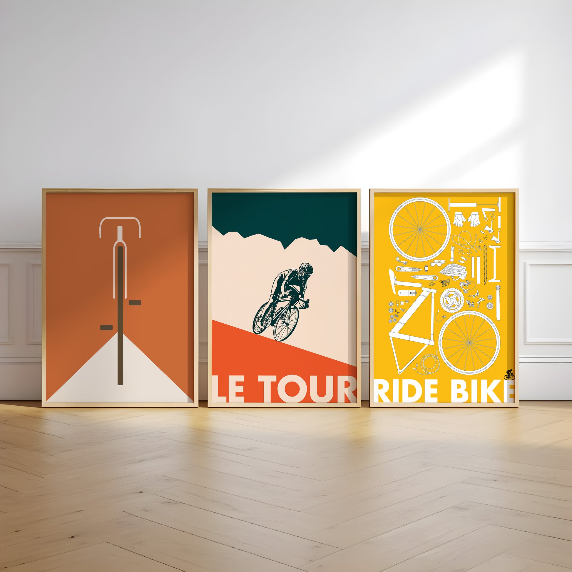 Set of three minimalist cycling poster prints featuring a bike silhouette, a road cyclist illustration, and a detailed bicycle parts diagram in bold graphic colors