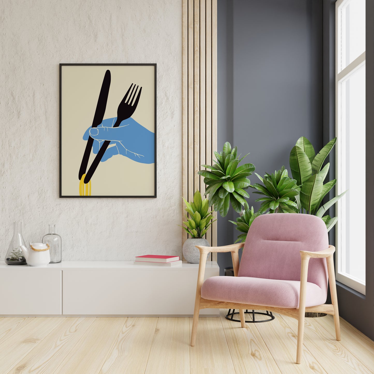 Graphic noodle wall art with a blue hand and black cutlery displayed in a bright reading nook.
