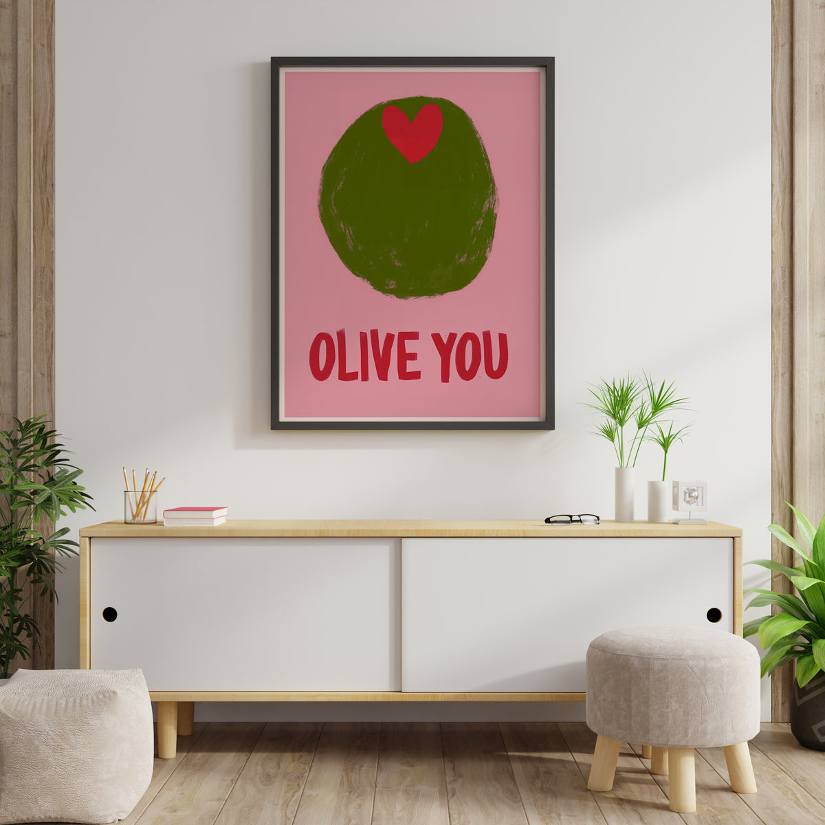 Playful olive print with red heart and OLIVE YOU quote displayed in a styled interior