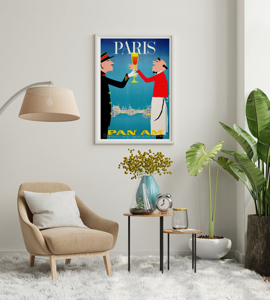 Paris Pan Am poster with toasting figures and bold yellow airline branding for a reading area.