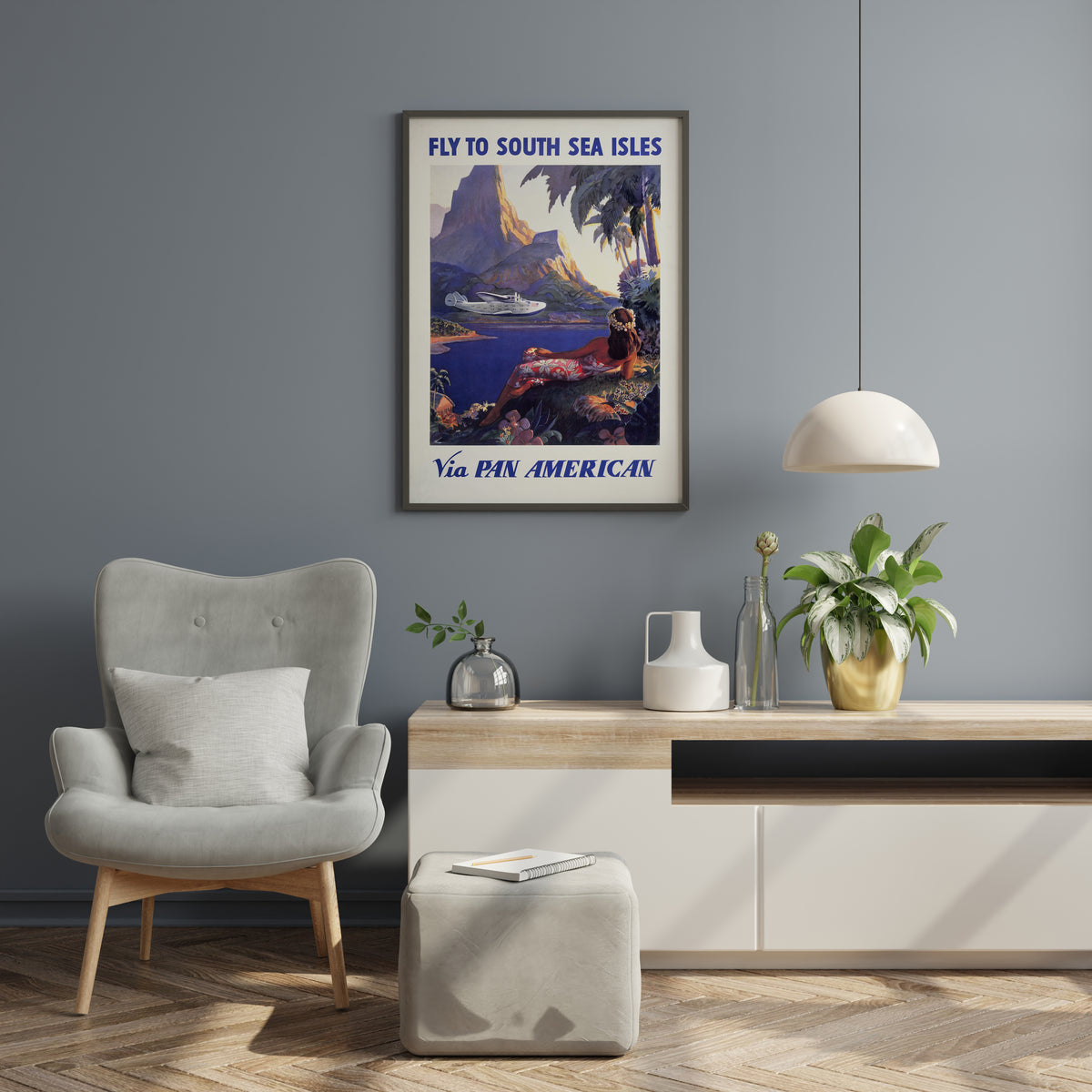 South Sea Isles print with reclining woman, flying boat and tropical landscape in a living room.