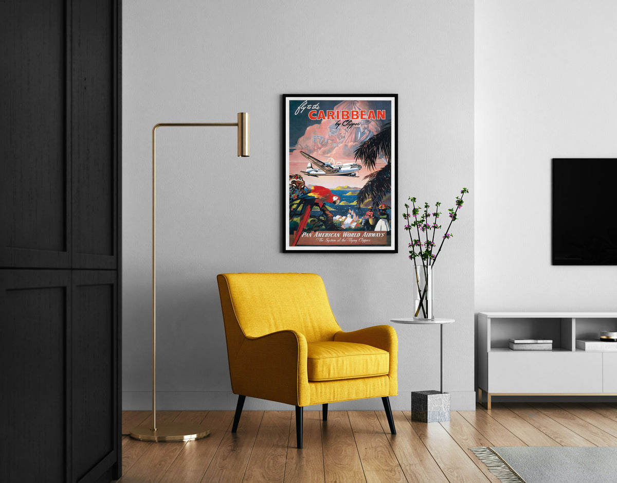 Caribbean travel poster with Pan American aircraft and tropical illustration in a living room setting