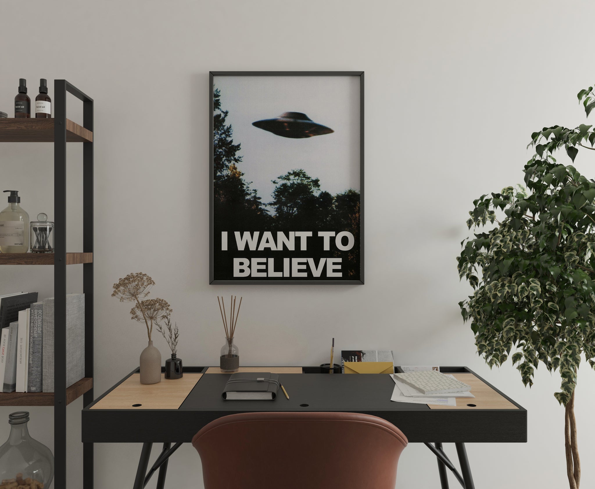Retro alien poster with a flying saucer and bold white text displayed in a home office.