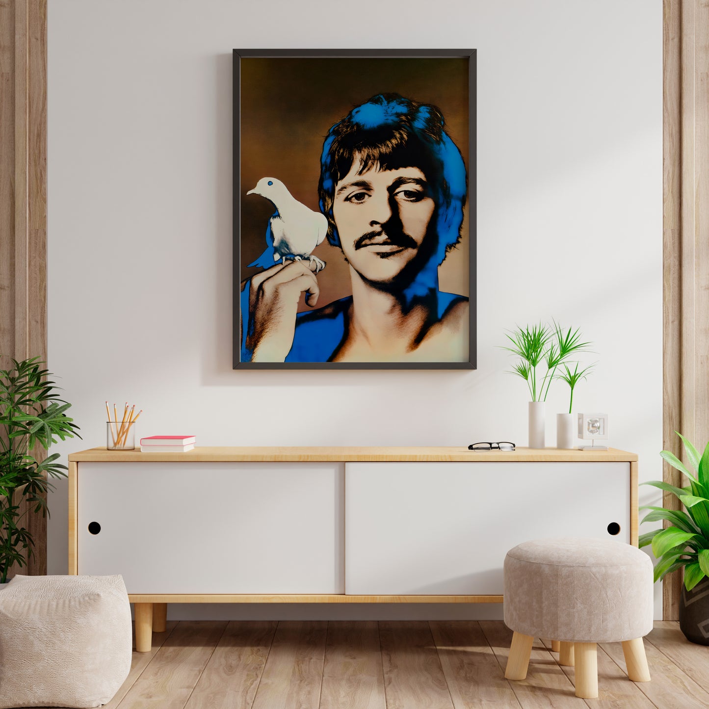 Ringo Starr Beatles poster with blue portrait and white dove displayed above a living room console