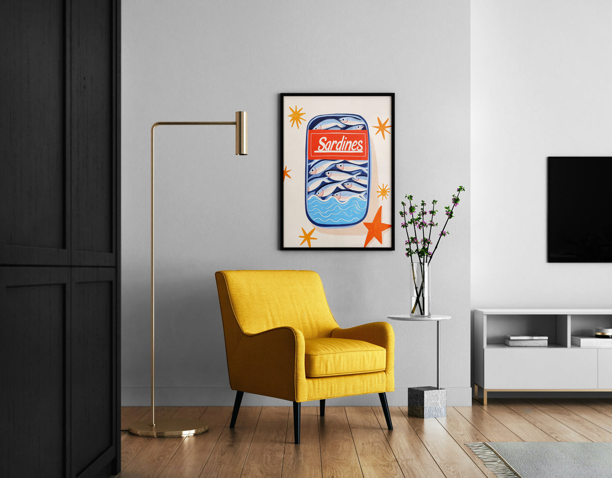 Tinned fish wall art with sardines, blue waves and orange accents in a modern room