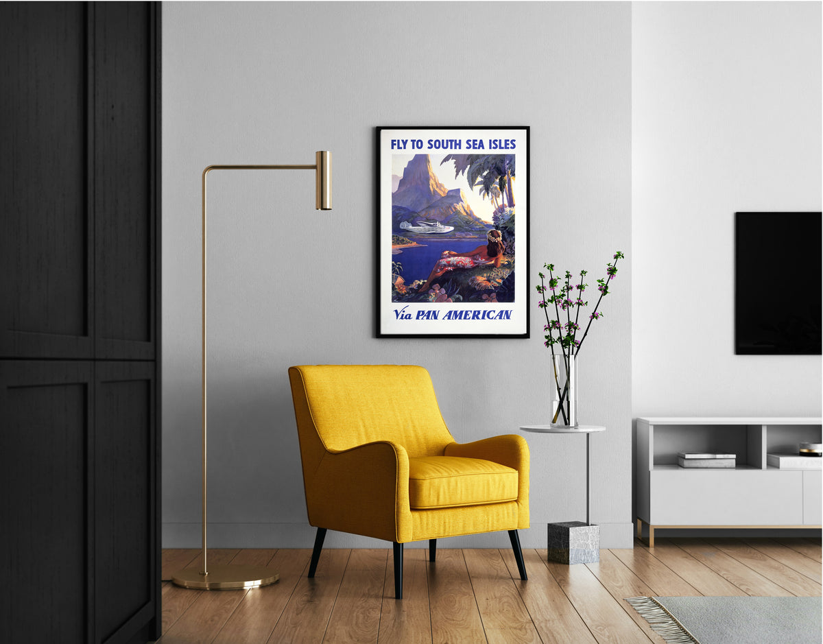 Pan American travel poster with flying boat, island mountain and tropical lagoon.
