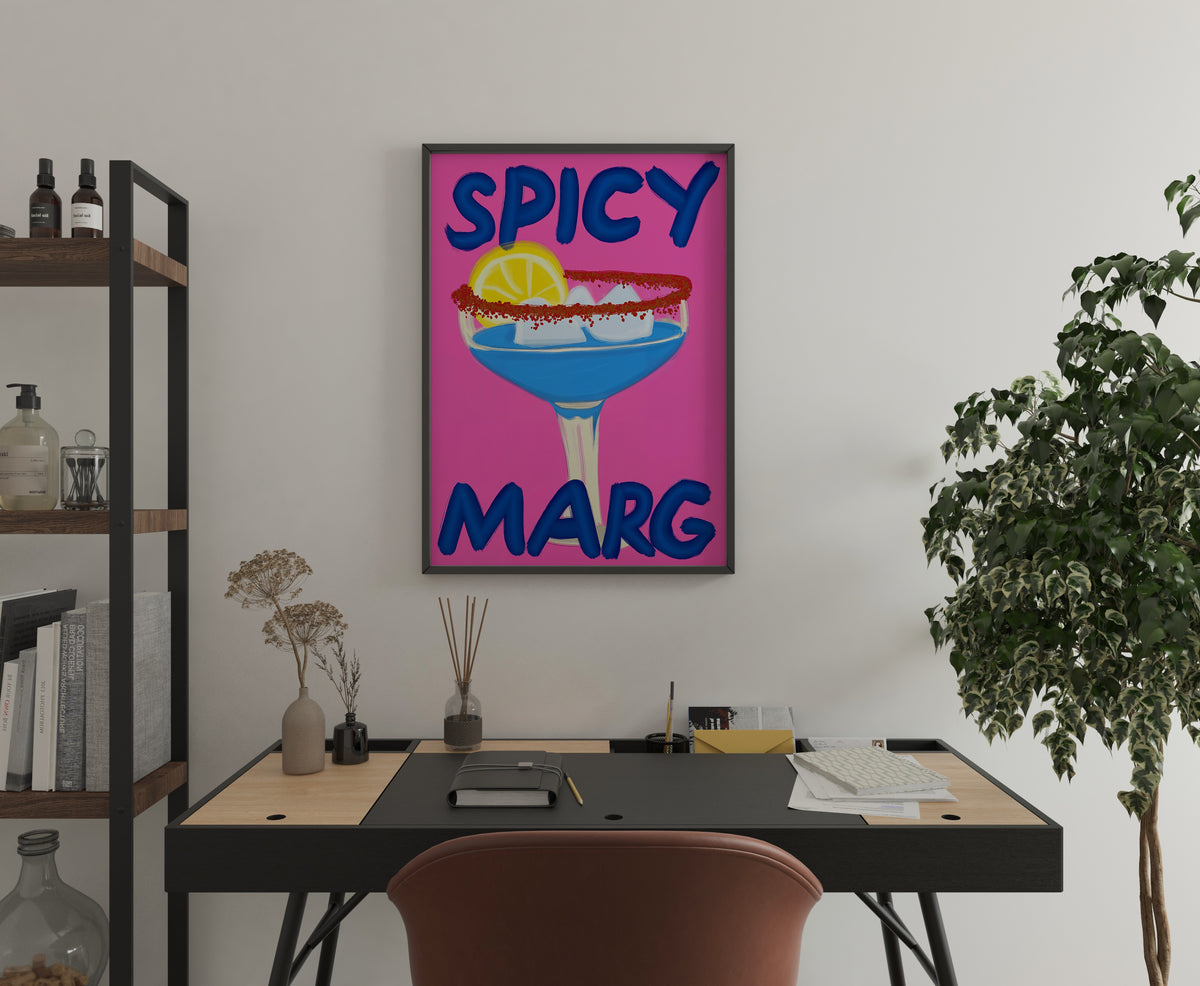 SPICY MARG cocktail poster with blue margarita displayed above a home office desk