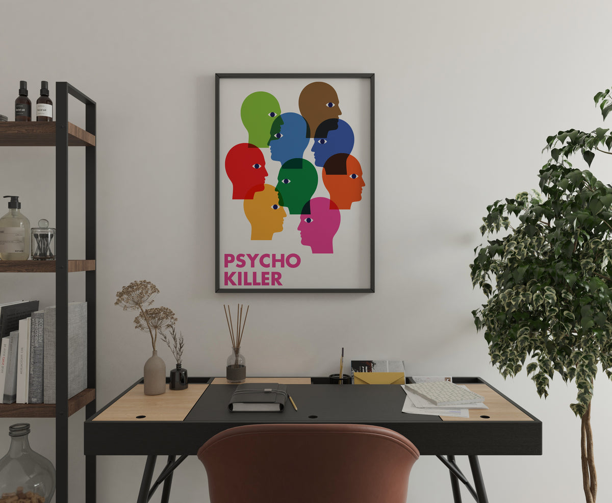 Talking Heads Psycho Killer poster with overlapping head silhouettes, shown in a home office.