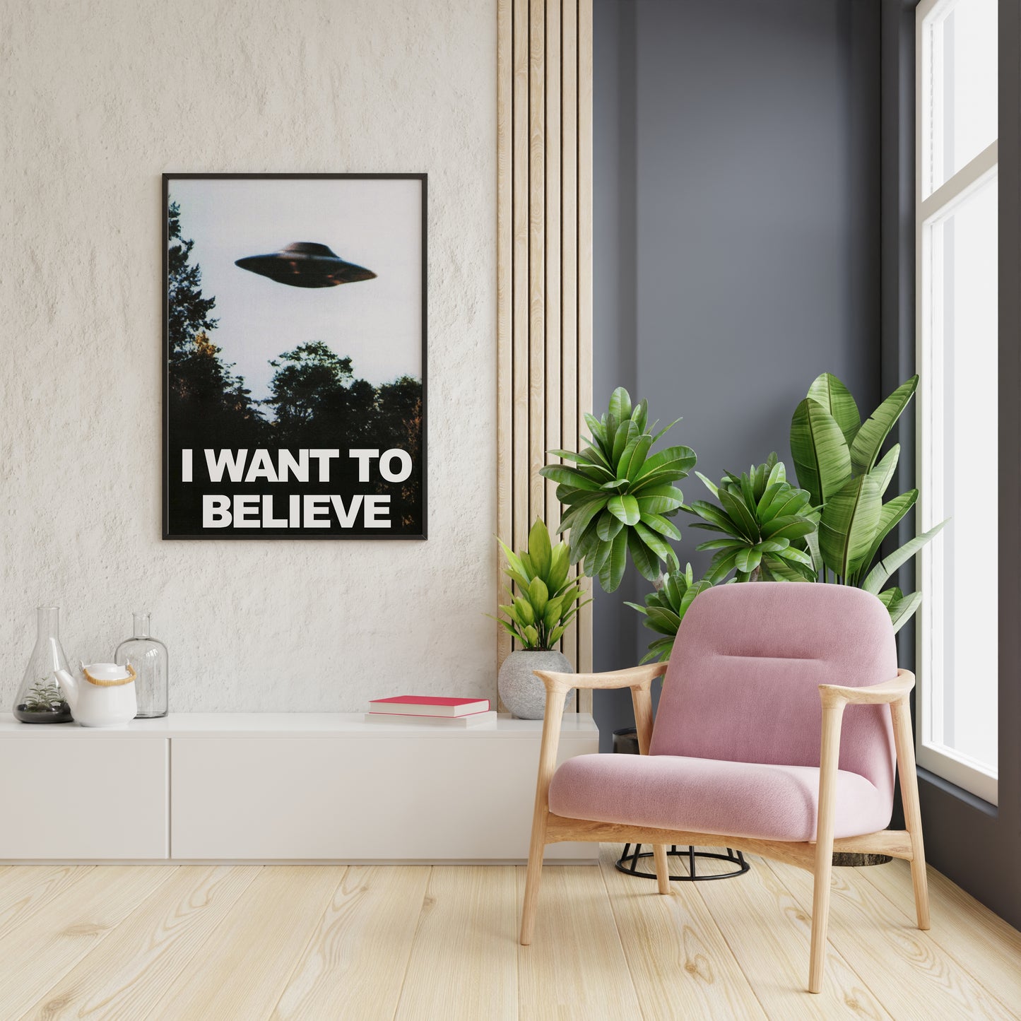 UFO typography poster with a saucer above trees shown in a bright reading nook.