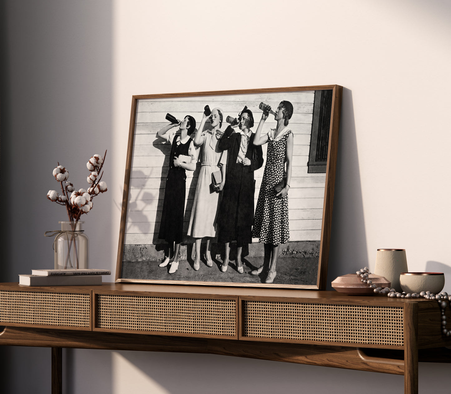 Vintage women drinking poster displayed as black and white photo print